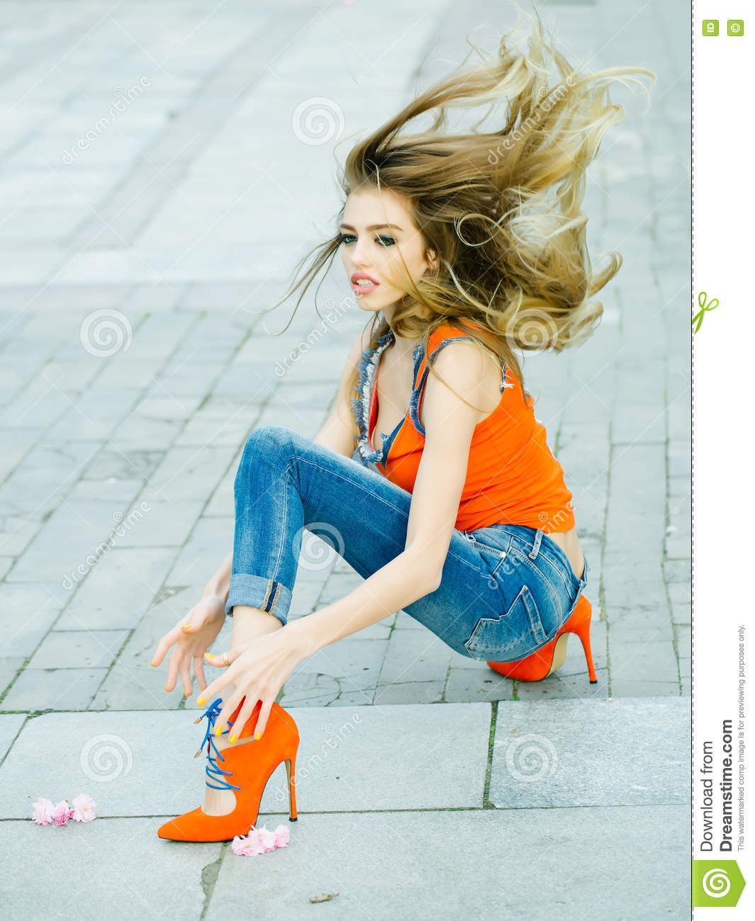Girl posing on froor high heels